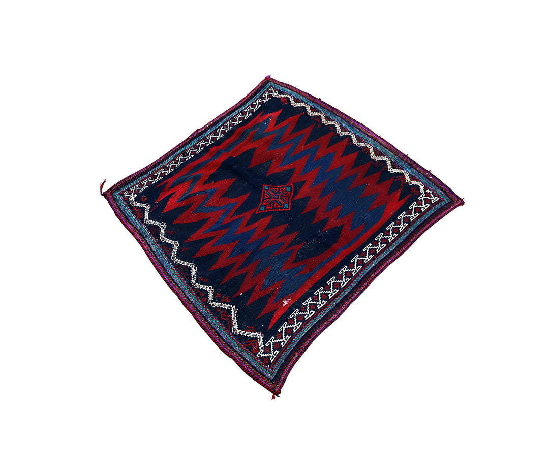 Authentic 4'x4' square Persian Rukursi Sofreh Kilim tribal rug with a hand-woven wool chevron pattern and textured flatweave pile details.