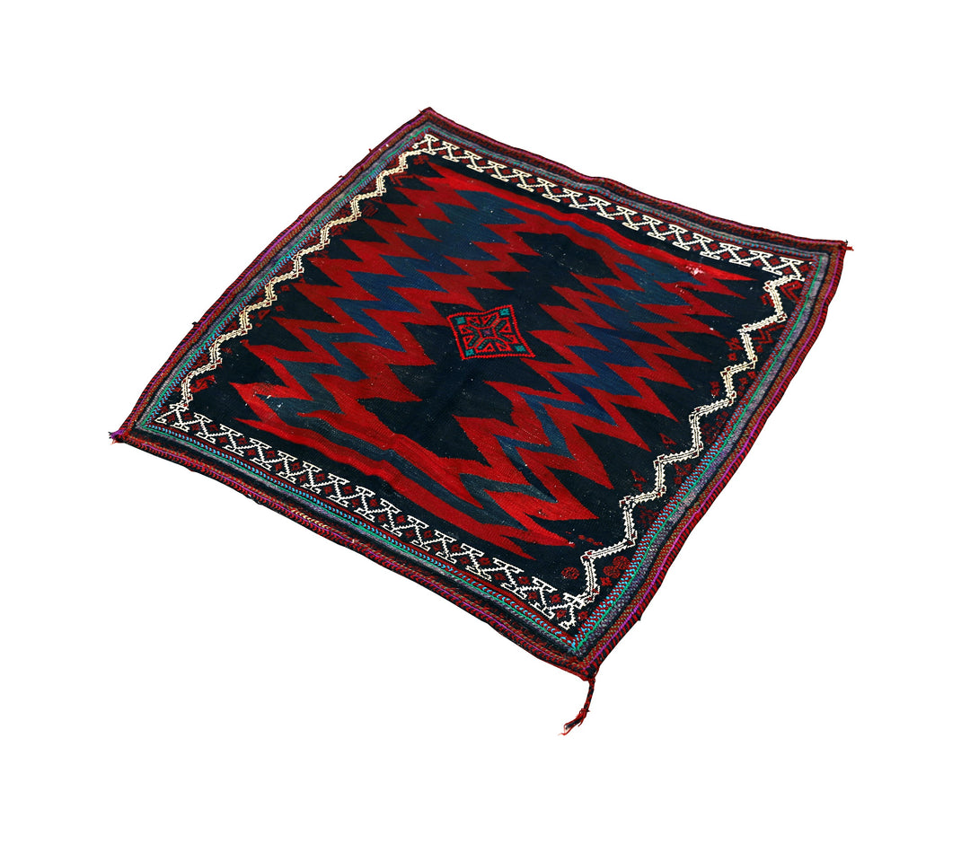 Authentic 4'x4' square Persian Rukursi Sofreh Kilim tribal rug with a hand-woven wool chevron pattern and textured flatweave pile details.