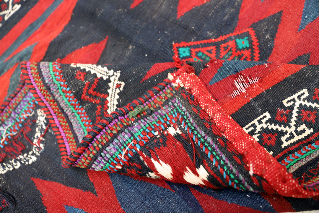 Authentic 4'x4' square Persian Rukursi Sofreh Kilim tribal rug with a hand-woven wool chevron pattern and textured flatweave pile details.