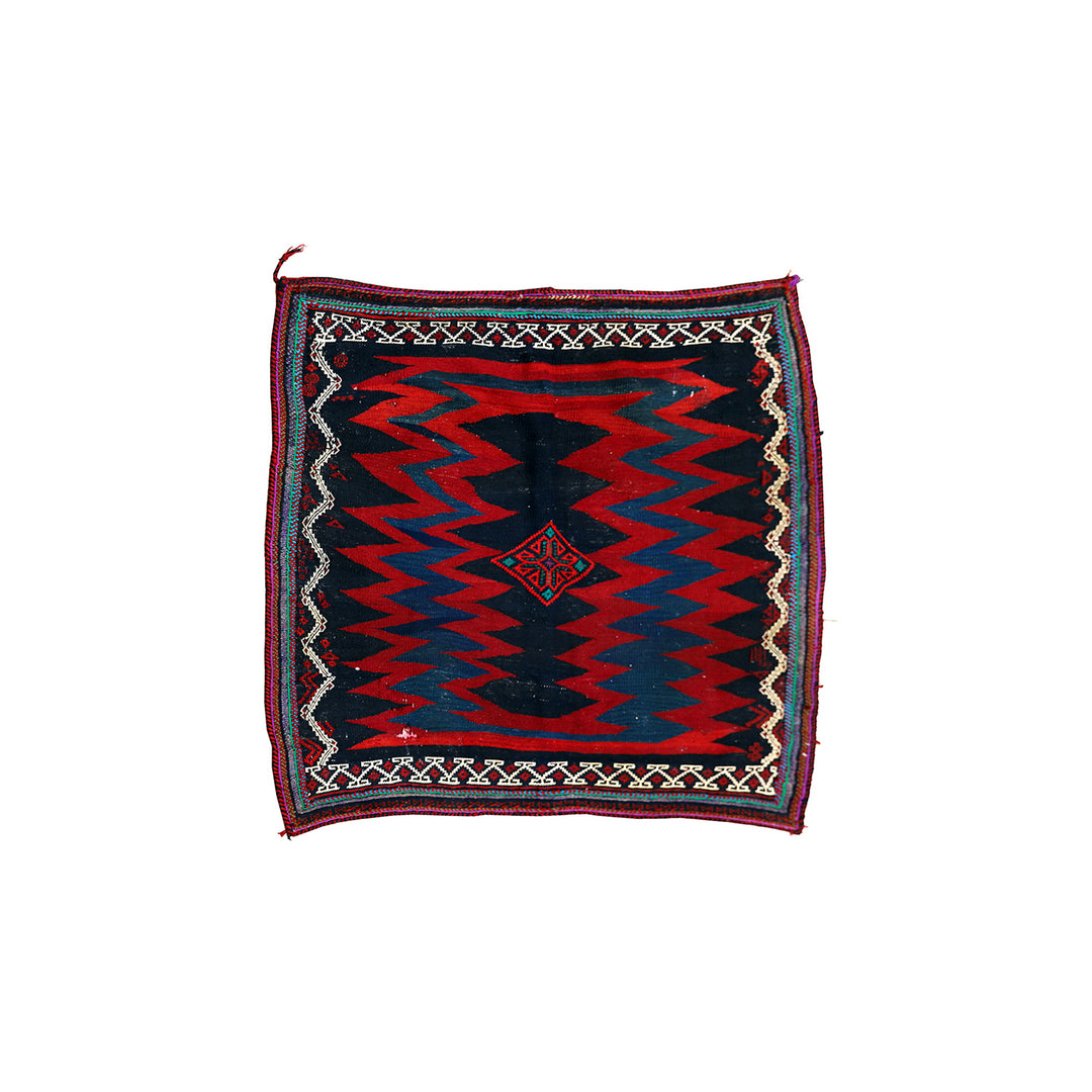 Authentic 4'x4' square Persian Rukursi Sofreh Kilim tribal rug with a hand-woven wool chevron pattern and textured flatweave pile details.