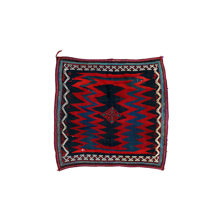 Authentic 4'x4' square Persian Rukursi Sofreh Kilim tribal rug with a hand-woven wool chevron pattern and textured flatweave pile details.