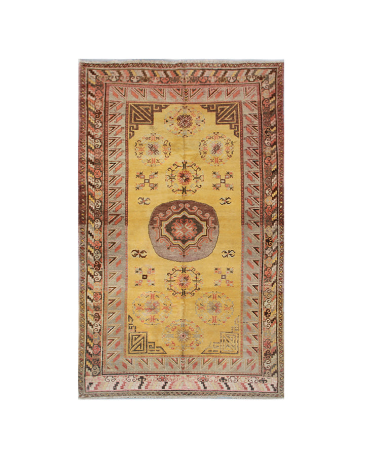 Rare antique hand-knotted Samarkand Khotan wool area rug featuring a central medallion on a unique luminous yellow field