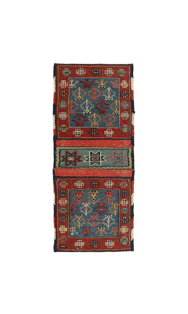 Small vintage Shahsavan Persian Soumak saddle bag with detailed blue and red geometric weaving.