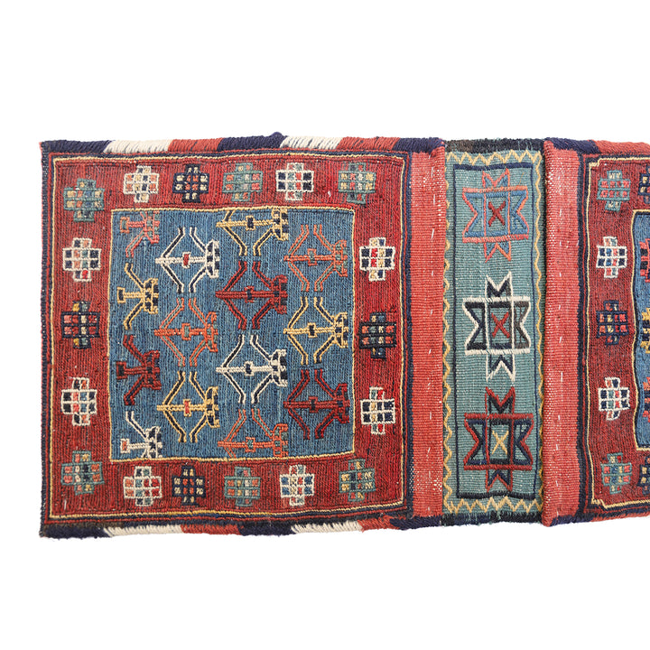 Small vintage Shahsavan Persian Soumak saddle bag with detailed blue and red geometric weaving.