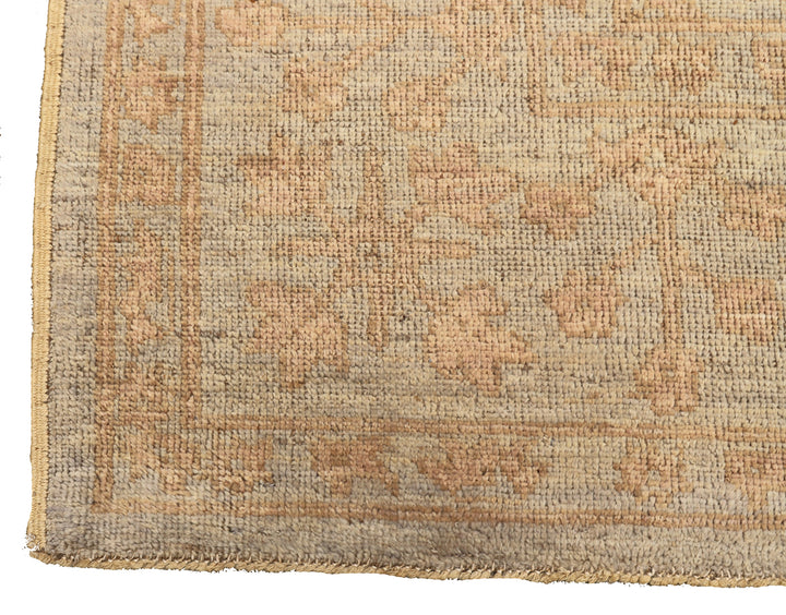 9x12 Soft washed floral Oushak hand-knotted luxury Afghan rug in organic wool with muted pastel tones, ethically woven by Hazara women artisans.