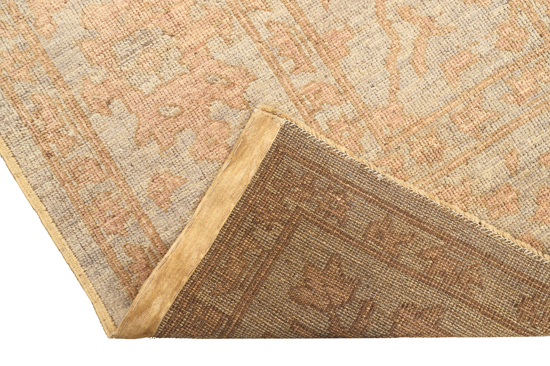 9x12 Soft washed floral Oushak hand-knotted luxury Afghan rug in organic wool with muted pastel tones, ethically woven by Hazara women artisans.
