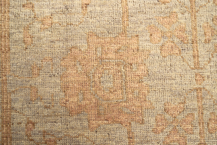 9x12 Soft washed floral Oushak hand-knotted luxury Afghan rug in organic wool with muted pastel tones, ethically woven by Hazara women artisans.