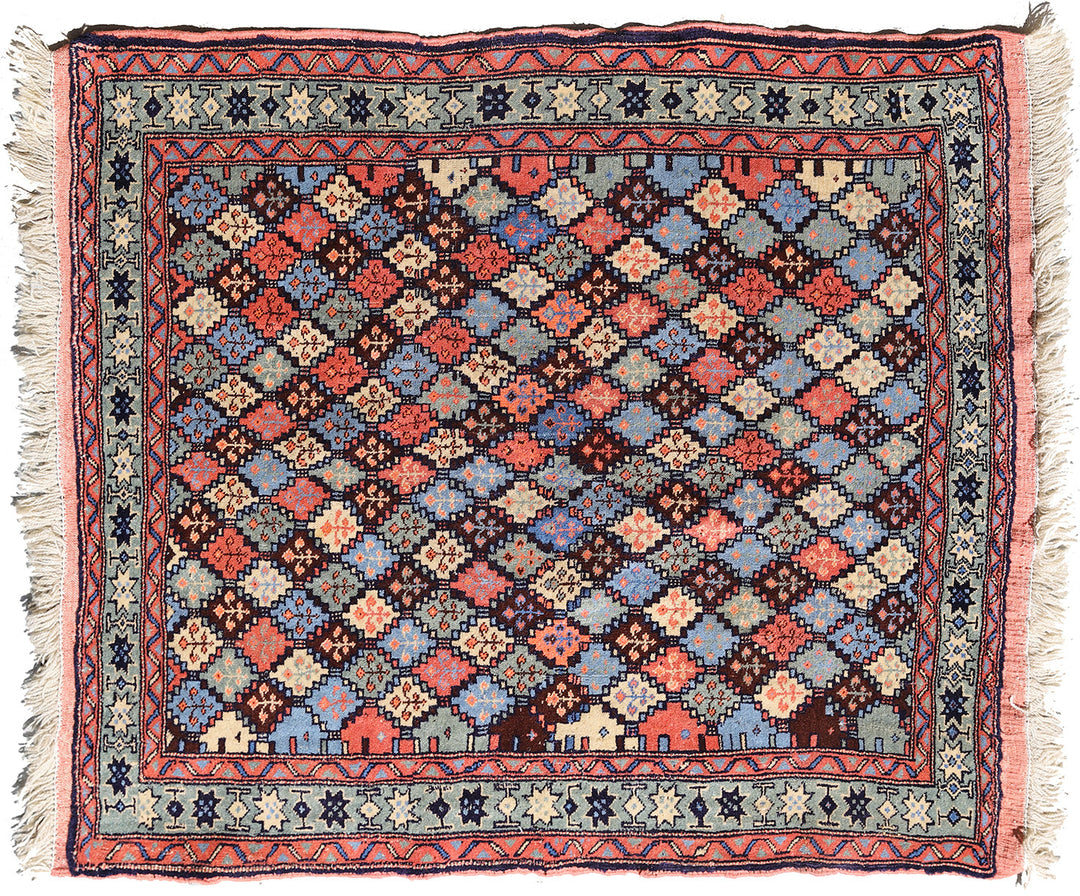 4x4 square Caucasian design wool rug with colorful geometric tribal motifs in 3 foot 10 inch by 3 foot 5 inch dimensions