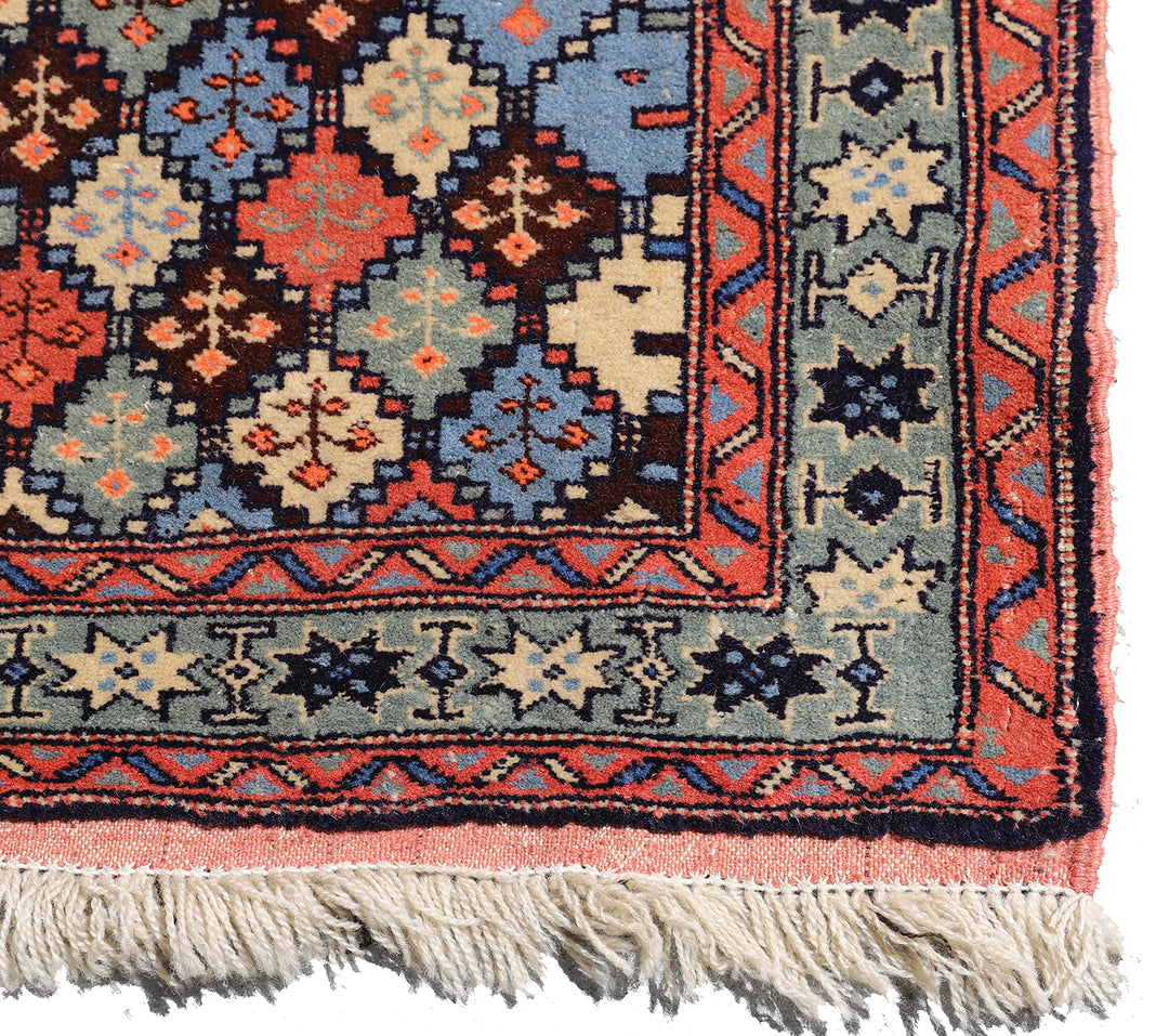 4x4 square Caucasian design wool rug with colorful geometric tribal motifs in 3 foot 10 inch by 3 foot 5 inch dimensions