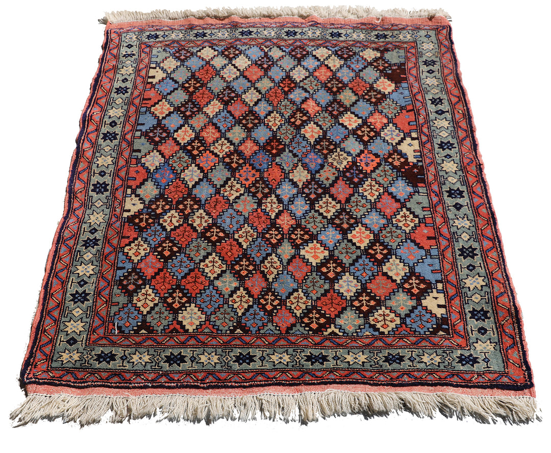 4x4 square Caucasian design wool rug with colorful geometric tribal motifs in 3 foot 10 inch by 3 foot 5 inch dimensions