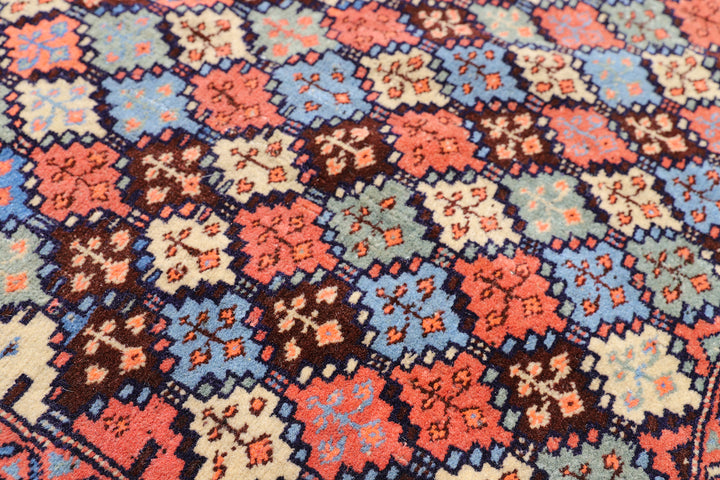 4x4 square Caucasian design wool rug with colorful geometric tribal motifs in 3 foot 10 inch by 3 foot 5 inch dimensions