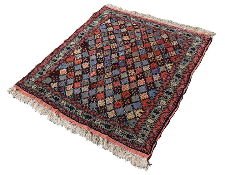 4x4 square Caucasian design wool rug with colorful geometric tribal motifs in 3 foot 10 inch by 3 foot 5 inch dimensions