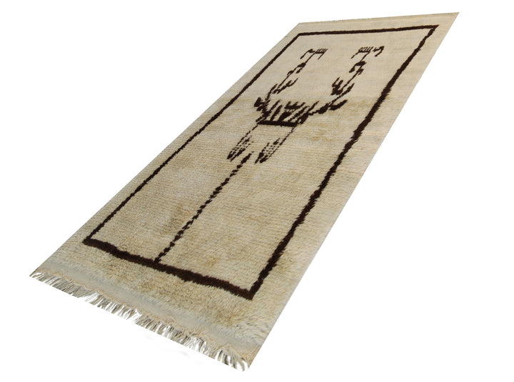 A small 3x5 vintage Turkish Tulu rug with a shaggy ivory wool pile and a minimalist brown tribal geometric design.