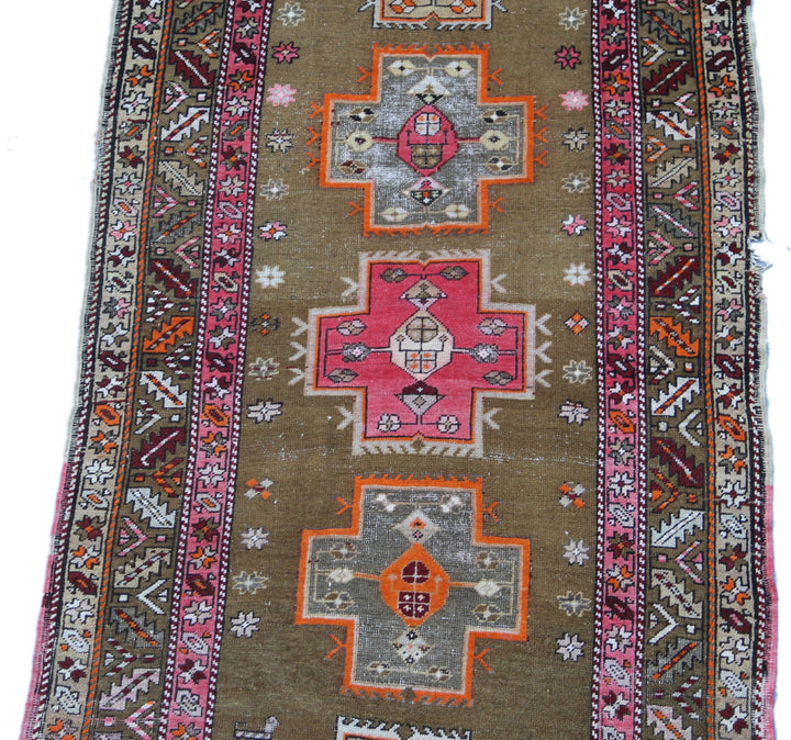 4x9 vintage Caucasian geometric runner rug with vibrant motifs and hand-knotted detailing