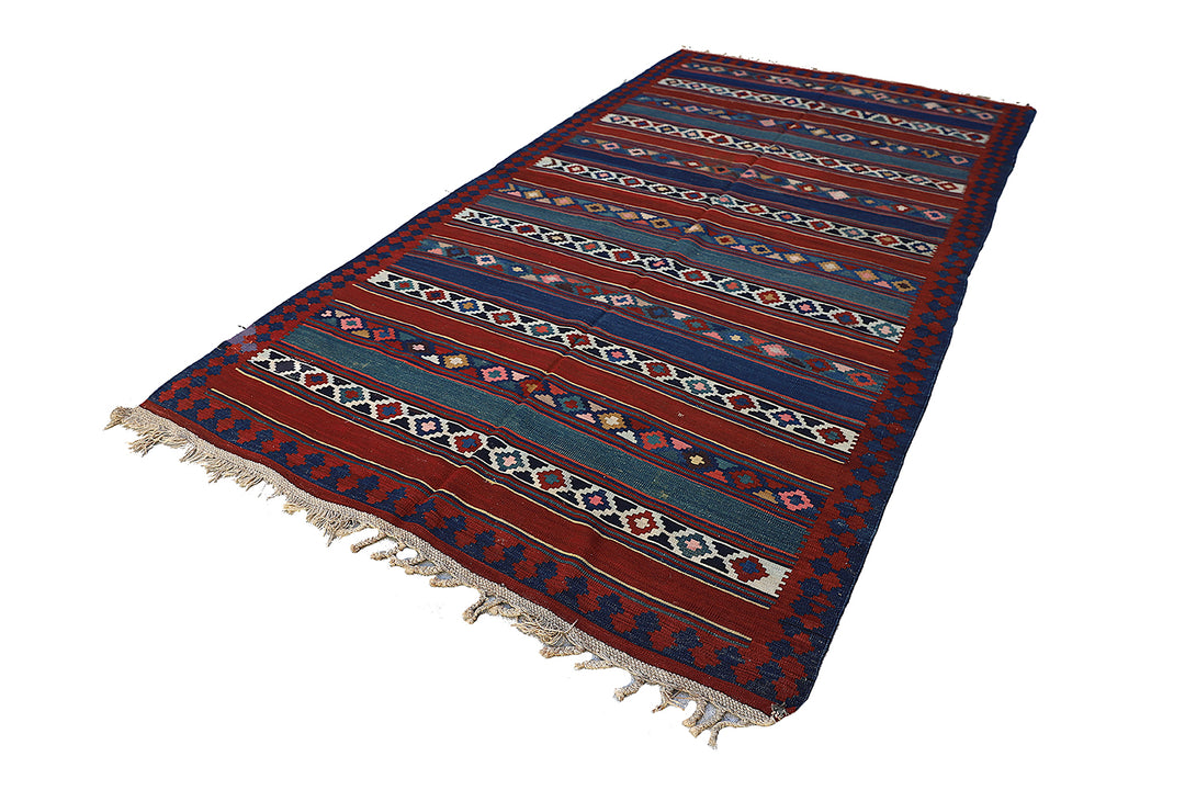 Vintage Caucasian flat-weave kilim rug with colorful vegetable-dyed geometric stripes and diamond motifs in terracotta red, green, and brown
