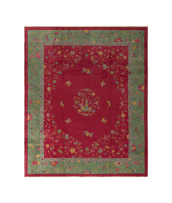 Vintage hand-knotted Chinese Art Deco wool rug in red with a green floral border.