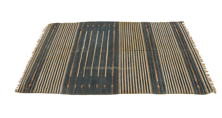 Striped rug with black and beige pattern on a white background