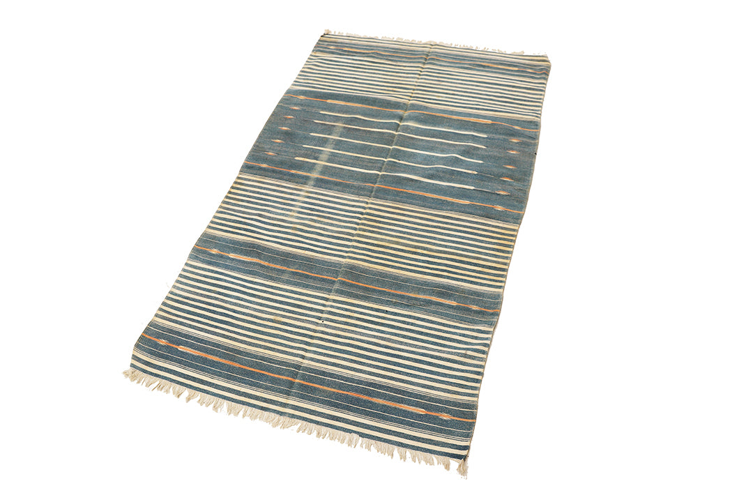 Striped rug with blue and beige colors on a white background