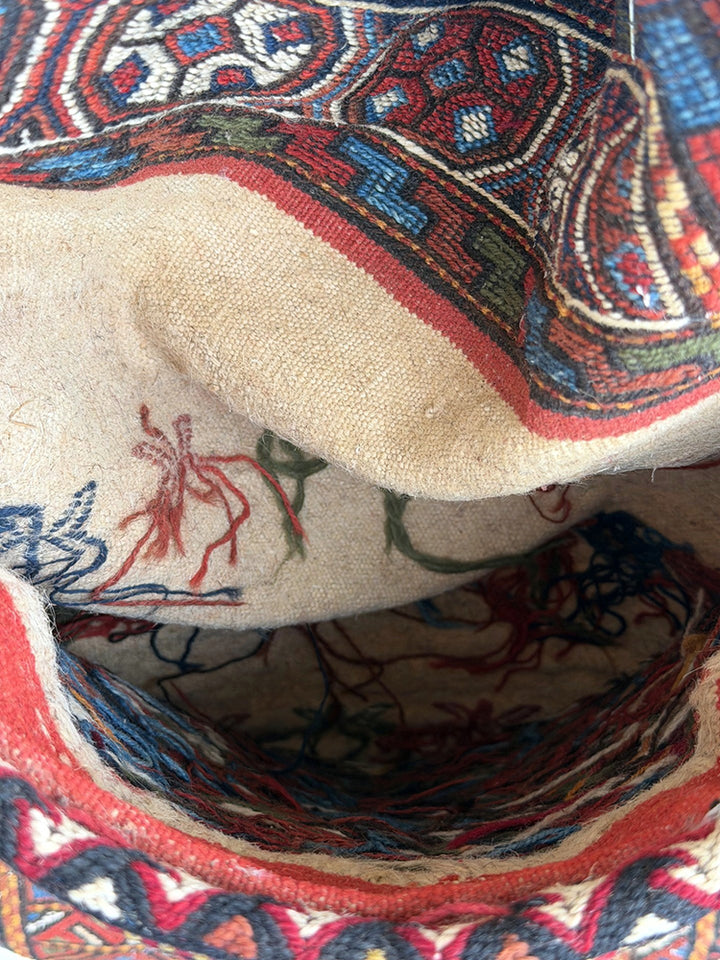 Pristine Persian tribal dowry saddle bag with intricate geometric wool weaving.