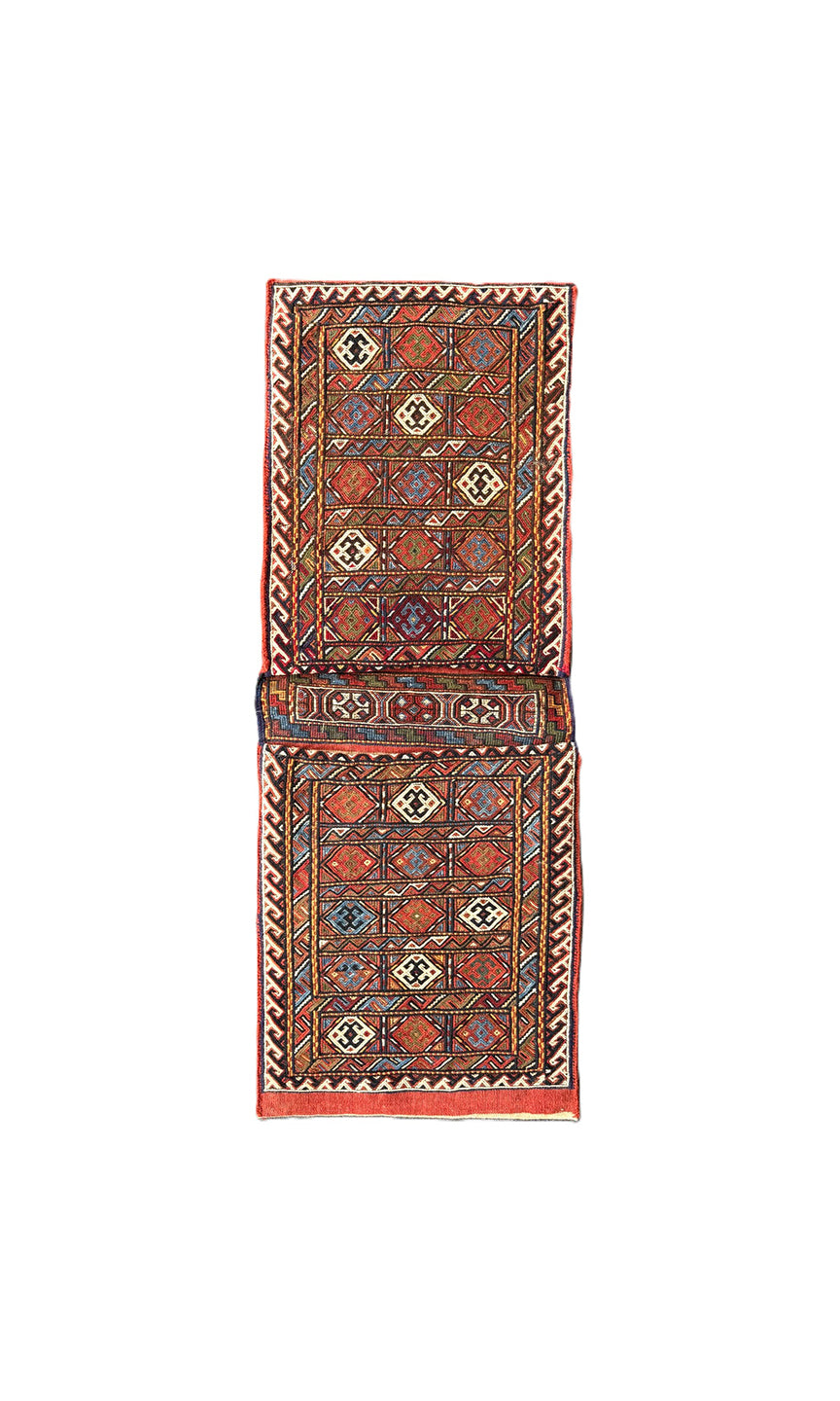Pristine Persian tribal dowry saddle bag with intricate geometric wool weaving.