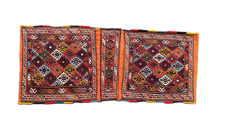 Pristine Persian tribal dowry saddle bag with intricate geometric wool weaving.