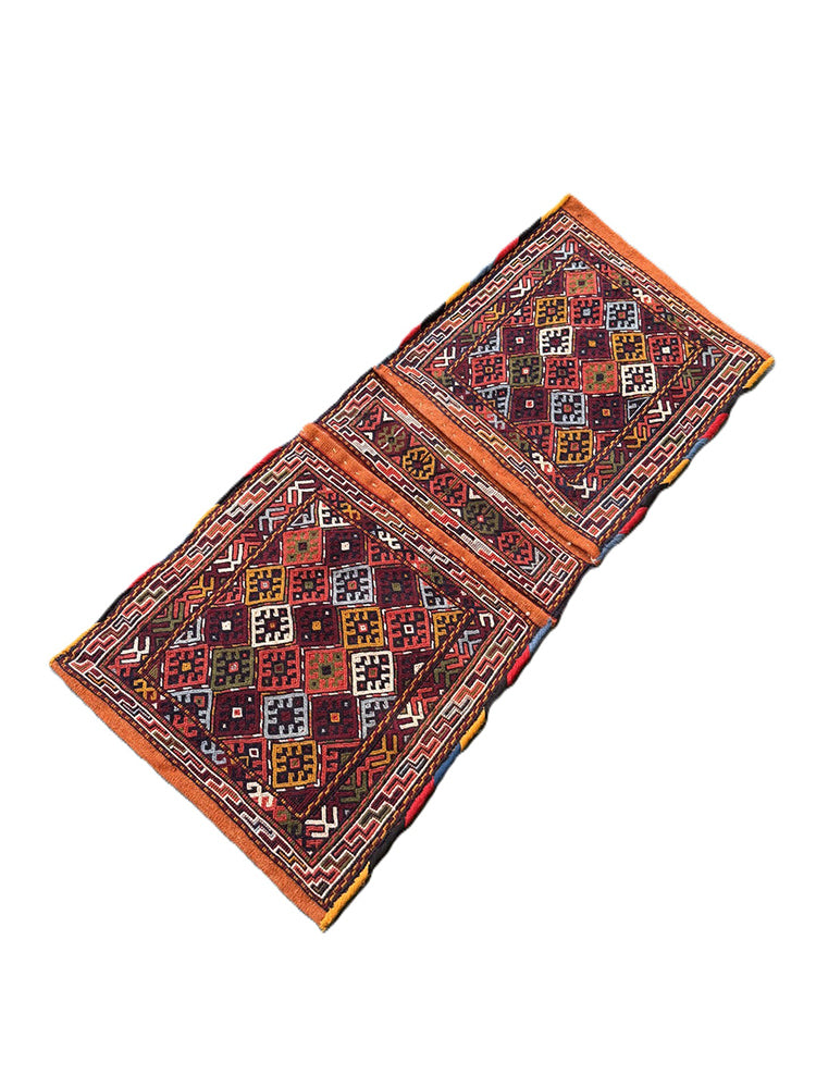 Pristine Persian tribal dowry saddle bag with intricate geometric wool weaving.