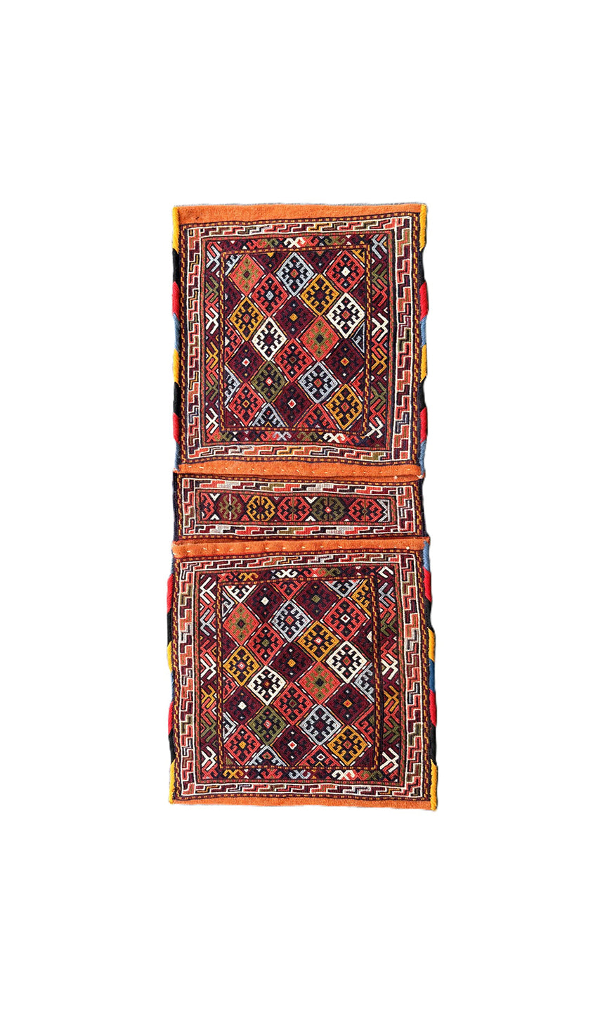Pristine Persian tribal dowry saddle bag with intricate geometric wool weaving.