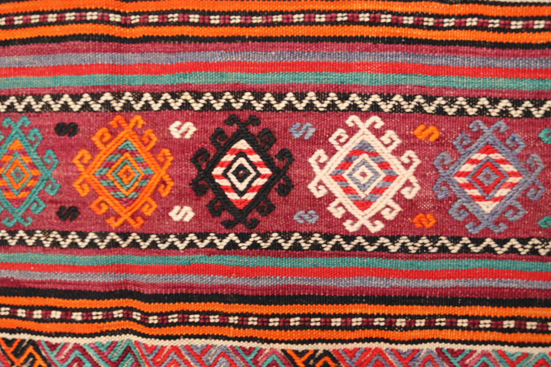 Fine vintage 5'2" x 9'9" Persian Soumak tribal kilim with ivory, red, and teal vegetable dyes, curated by Ariana Rugs in West Hollywood.