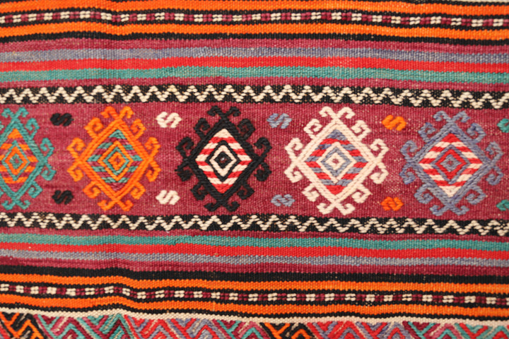 Fine vintage 5'2" x 9'9" Persian Soumak tribal kilim with ivory, red, and teal vegetable dyes, curated by Ariana Rugs in West Hollywood.