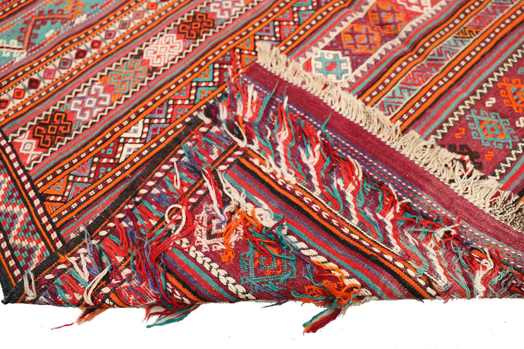 Fine vintage 5'2" x 9'9" Persian Soumak tribal kilim with ivory, red, and teal vegetable dyes, curated by Ariana Rugs in West Hollywood.