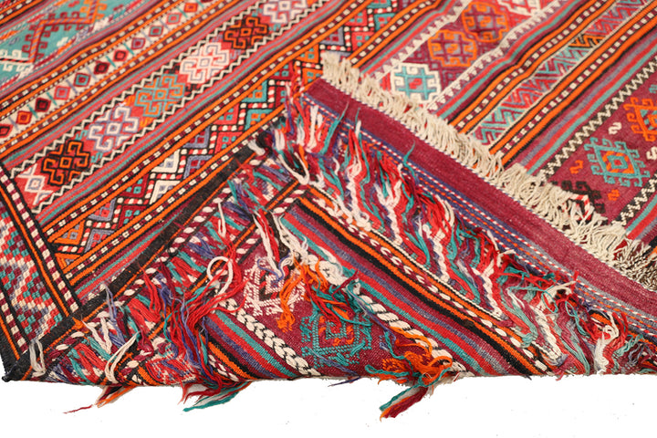 Fine vintage 5'2" x 9'9" Persian Soumak tribal kilim with ivory, red, and teal vegetable dyes, curated by Ariana Rugs in West Hollywood.