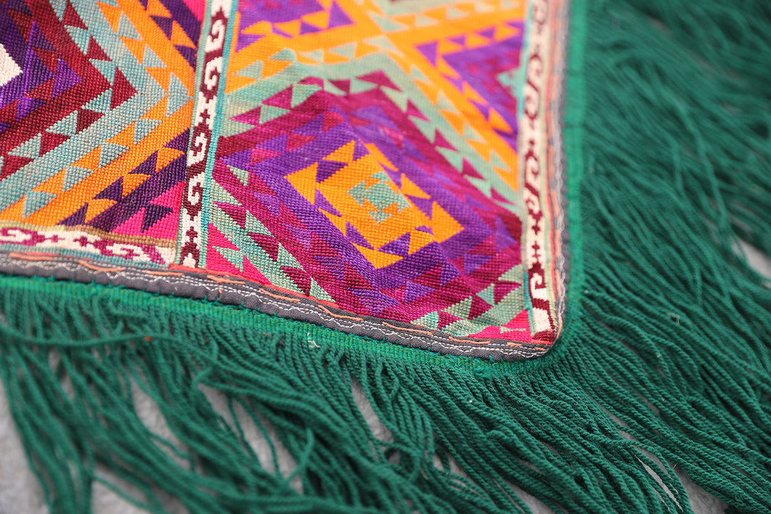 Authentic vintage Uzbek Saye Gosha textile featuring a traditional V-shape design with intricate hand-embroidered tribal floral medallions and decorative trim.