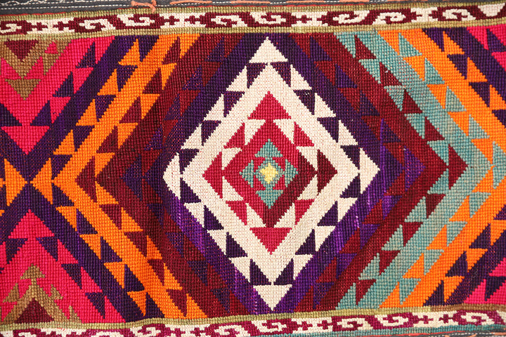 Authentic vintage Uzbek Saye Gosha textile featuring a traditional V-shape design with intricate hand-embroidered tribal floral medallions and decorative trim.