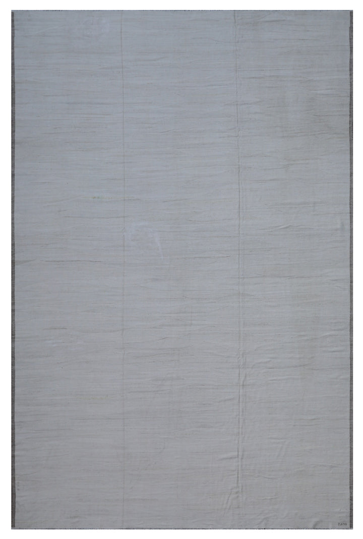 A solid white Ariana kilim rug with a textured design, rectangular in shape.