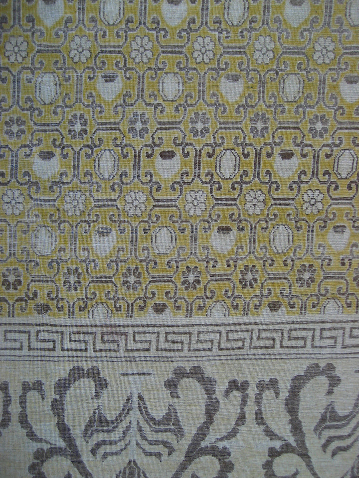 Patterned fabric with geometric design on a yellow and gray background