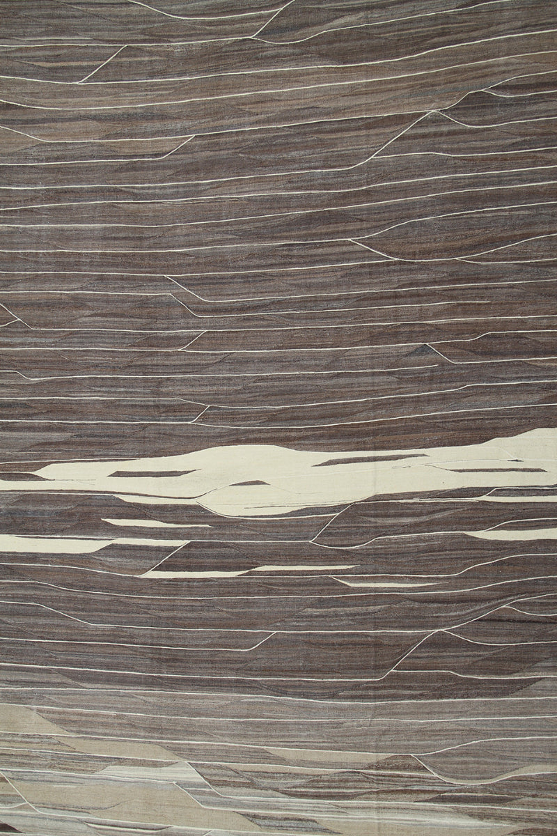 Close-up of a textured brown and beige surface with wavy patterns