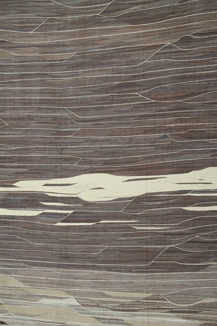 Close-up of a textured brown and beige surface with wavy patterns