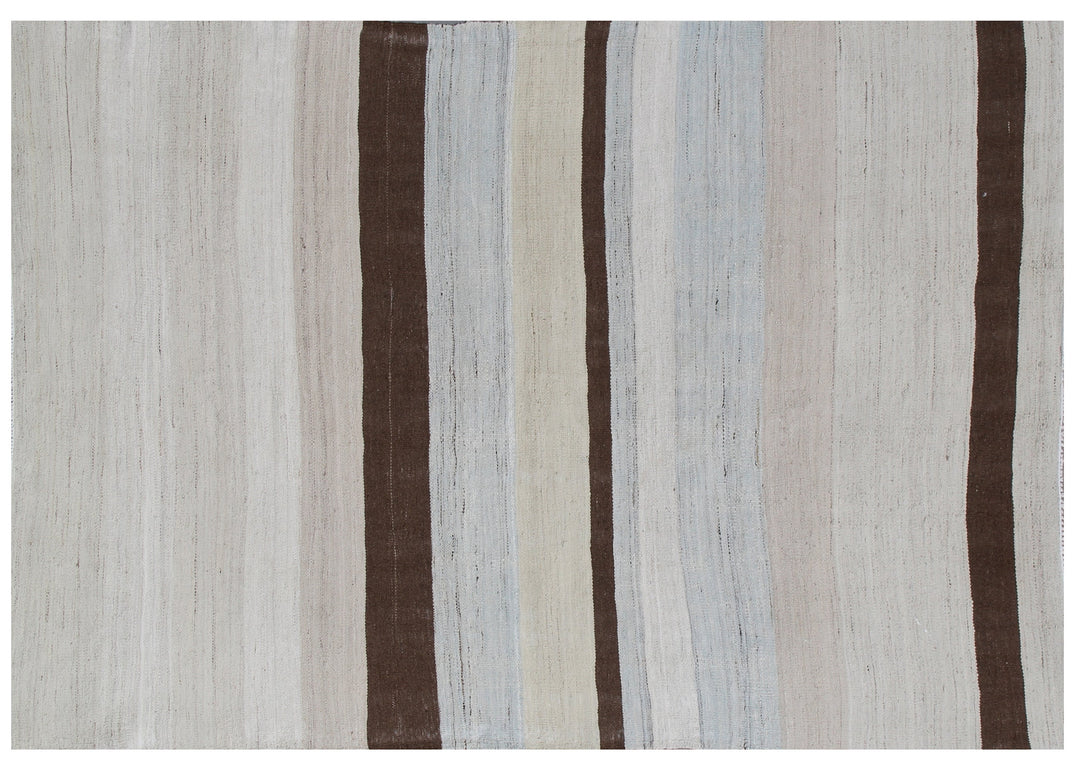 A 5x7 Ariana handmade wool flatweave kilim rug featuring a soft blue and white striped design layout.