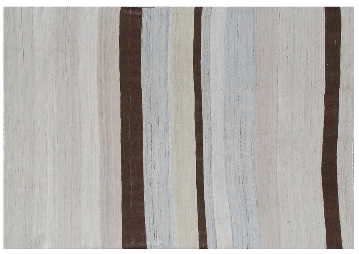 A 5x7 Ariana handmade wool flatweave kilim rug featuring a soft blue and white striped design layout.