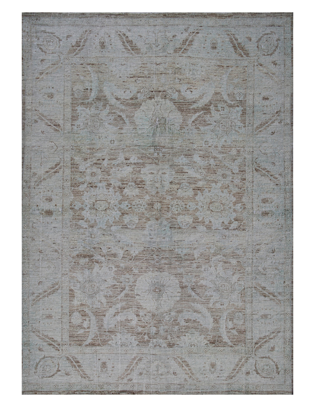 A rectangular traditional wool rug with a vintage design, featuring soft colors and intricate patterns.