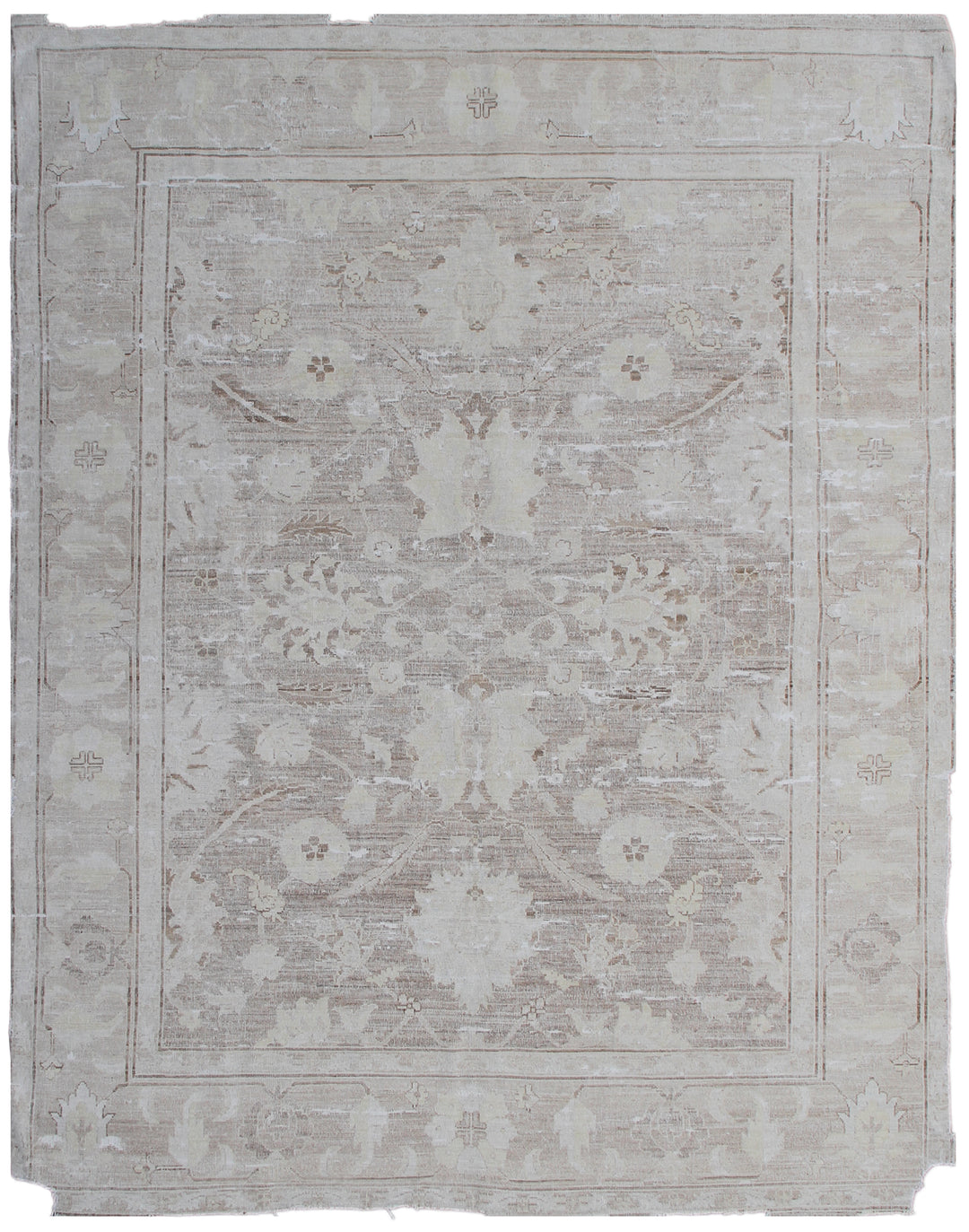 A vintage-style beige and white floral patterned rug