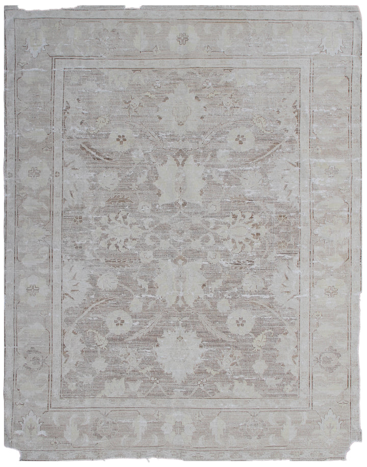 A vintage-style beige and white floral patterned rug