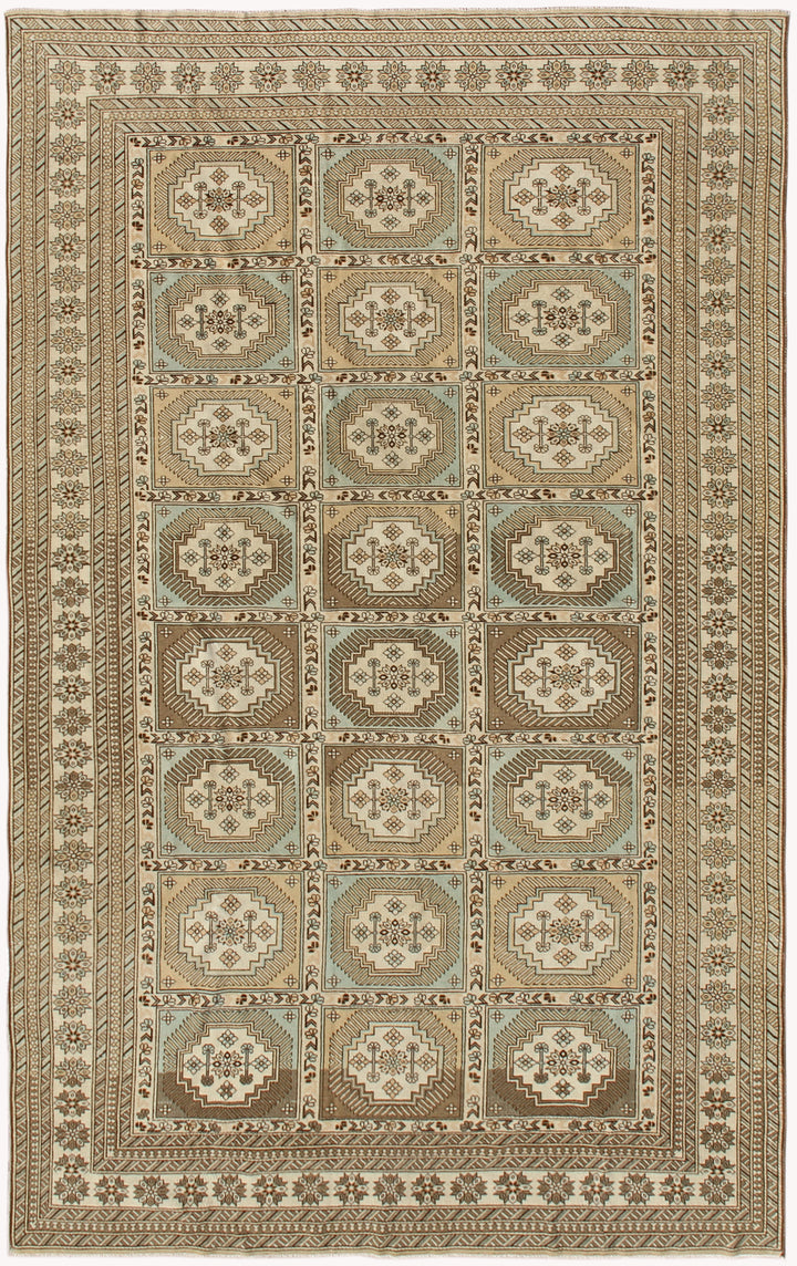 A geometric Ariana Hazara rug with a soft color palette, featuring a cream, beige, tan, brown, and blue color scheme.