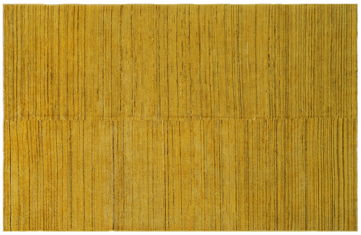 Hand-knotted wool Ariana Over-dye rug with a Mustard Gold and Brown Stria textured design, measuring 8’8” x 5’7”.