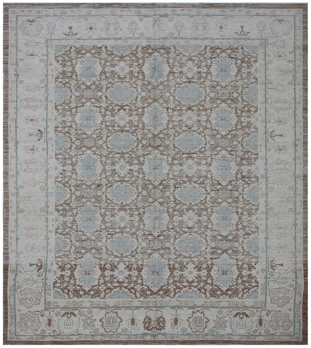 A rectangular, traditional wool rug with a blue and brown floral Agra design pattern.