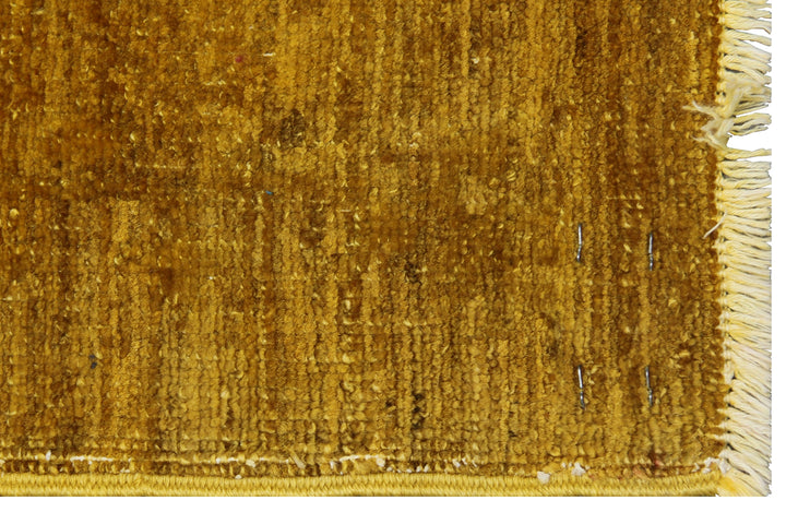 8'x10' golden yellow Ariana overdyed hand-knotted wool area rug featuring a saturated yellow wash and traditional motifs