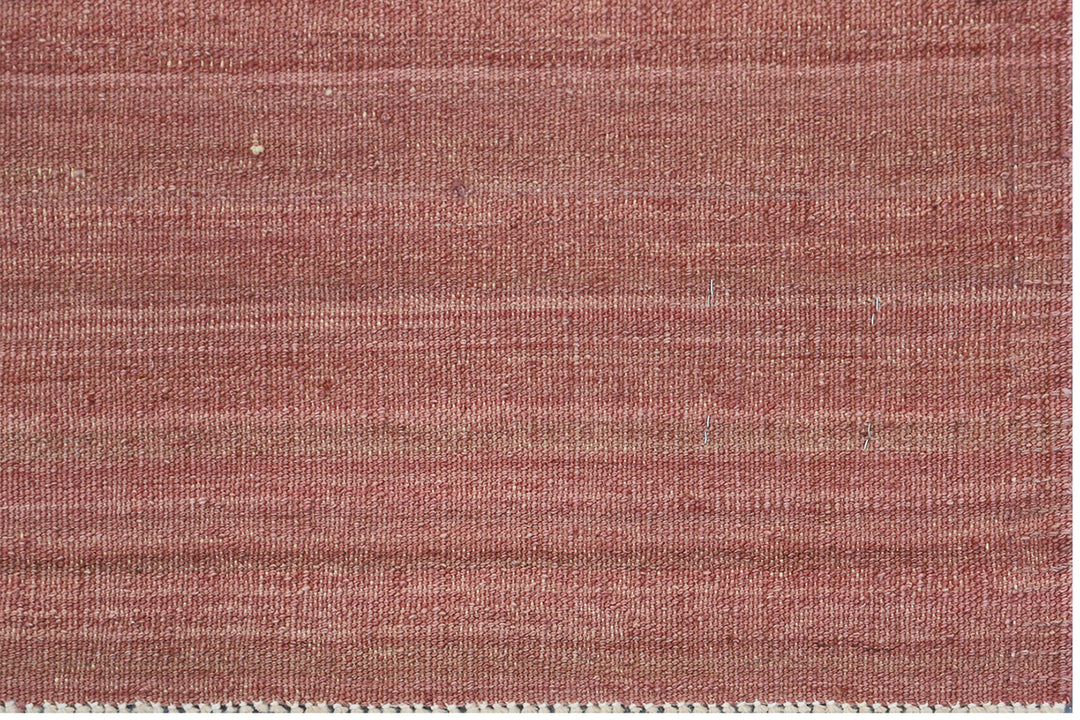 Handwoven wool kilim in copper and cinnamon sunset tones with a striped stria design, crafted in Afghanistan. Luxury flatweave from the Ariana Kilim Collection.