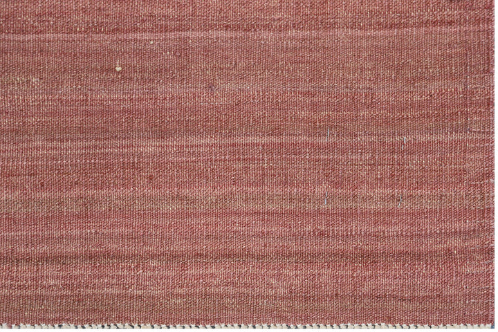 Handwoven wool kilim in copper and cinnamon sunset tones with a striped stria design, crafted in Afghanistan. Luxury flatweave from the Ariana Kilim Collection.