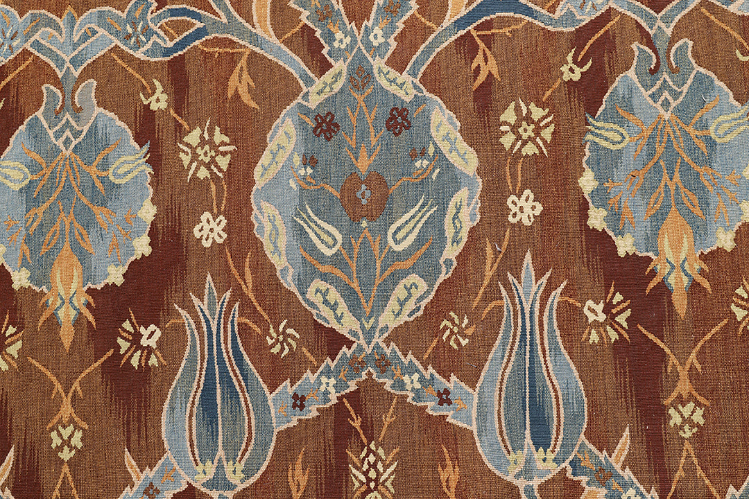 Large handwoven wool kilim in brown, blue, and ivory with Ottoman design. Luxury 12×18 flatweave rug from the Ariana Kilim Collection.