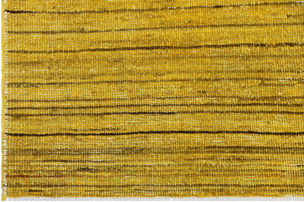 Hand-knotted wool Ariana Over-dye rug with a Mustard Gold and Brown Stria textured design, measuring 8’8” x 5’7”.
